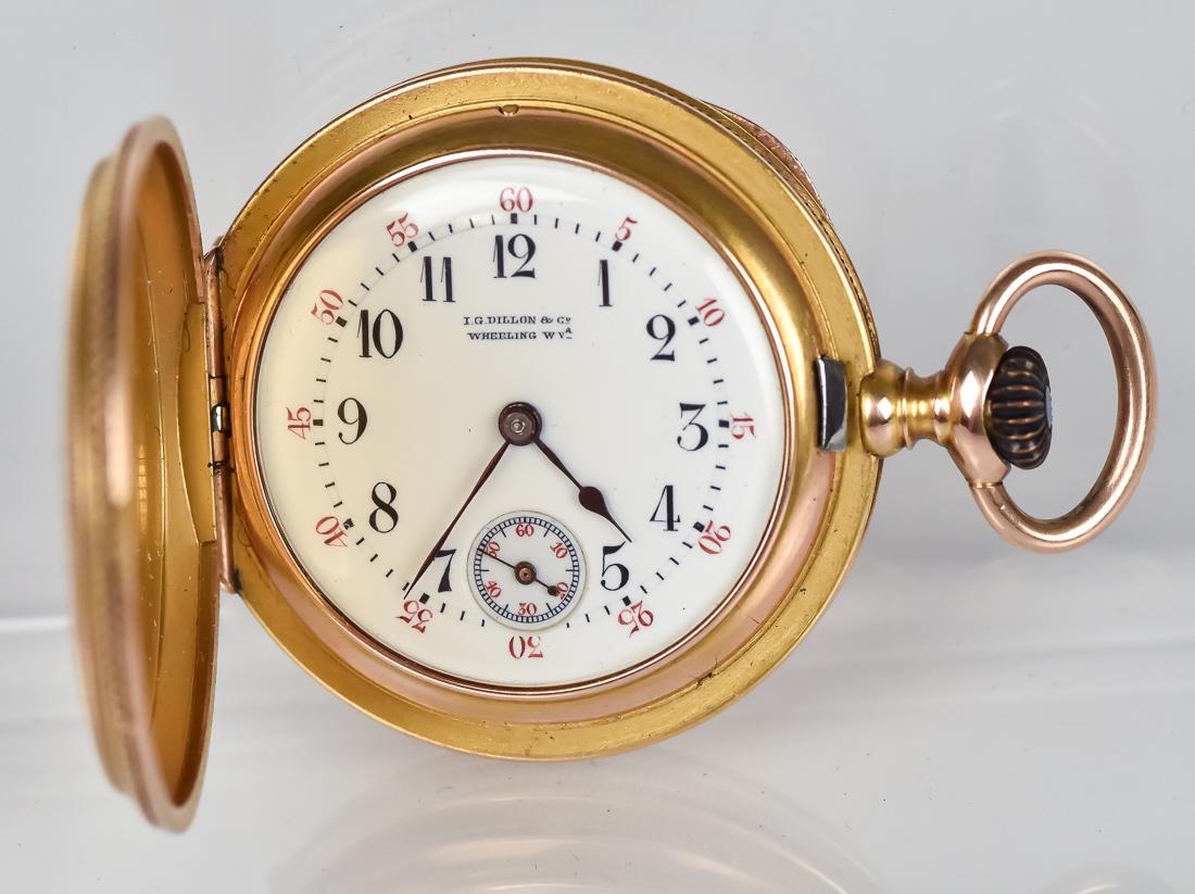 I.G. Dillon Gold Pocket Watch: Closed face with textured surface to resemble raw gold nuggets surface. Ladies watch marked on enameled dial I.G. Dillon & Co./Wheeling, W.Va. Case marked 14 flanking entwined initials JS and numbered