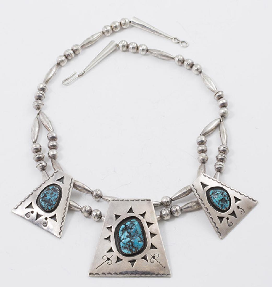 Navajo Turquoises & Sterling Necklace: Stamped GWR and engraved Nelson Pacheco, with three pendants with inset turquoise cabochons, total weight with stones 2.95 ozt.