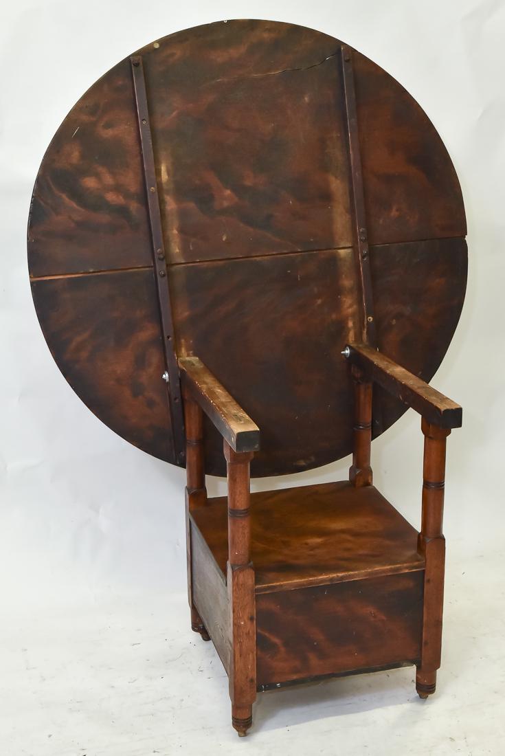 Early Hutch Table: Circa 1780 in oak with mortised and pinned construction, round two board flip top straight arms with turned front posts, box seat with lift lid and turned legs, old varnish finish, 41" diameter x 28 1