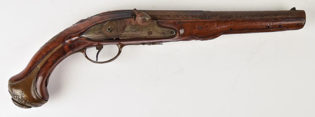 Fine 18th Century Converted Flint Lock Pistol: With 8 1/2" round to octagonal barrel with gold floral inlay and engraving, chased and engraved brass butt plate, trigger guard and back plate, carved walnut stock, replaced percussion lock, missing h