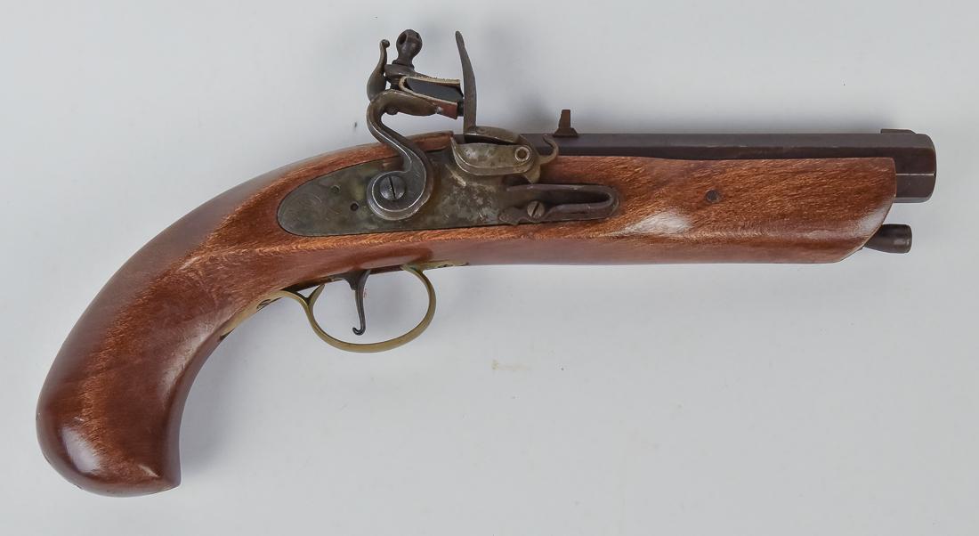 Flint Lock Pistol: Circa .50 caliber newer copy of 18th century original with 6 3/8" octagonal barrel marked Black Powder Only, unmarked lock with floral scroll engraving, steel ram rod, brass trigger guard & black plat
