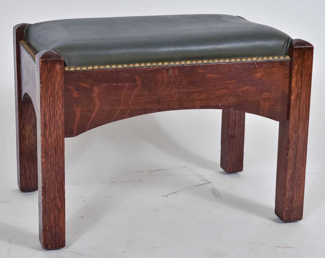 Jamestown Chair Co. Footstool: Oak, arched stretchers, square legs, newer black leather & brass tacks, good condition, original dark finish, 15 1/2" high x 21 1/2" wide 13 1/2" deep.
