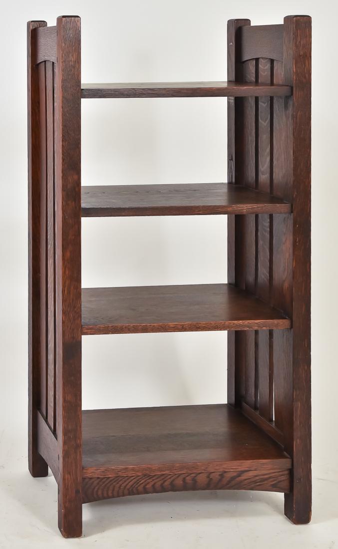 L. & J.G. Stickley No. 46 Magazine Stand: Oak, No. 46, with four shelves, three slat sides and arched stretchers, signed with clamp decal, very good condition, 42" high x 21" wide x 12" deep, in very good dark original finish.