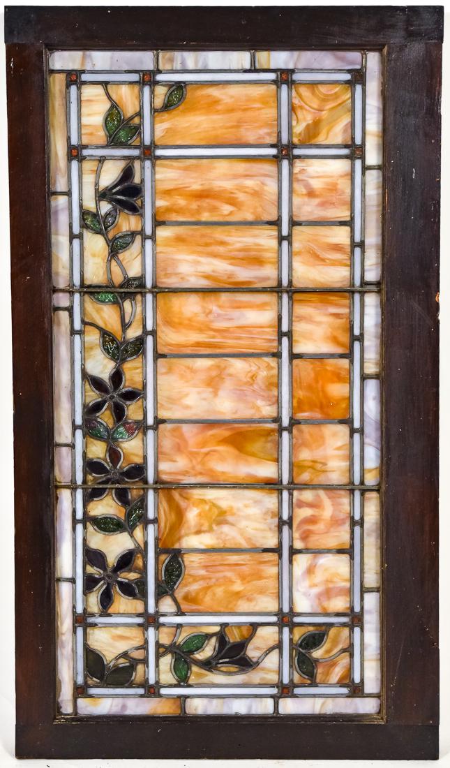 Arts & Crafts Stain Glass Window: Leaded, circa 1900 with vining floral design on geometric ground in various color and slag glass, set in original wooden frames, each 25 1/2 high x 44 1/2" long.