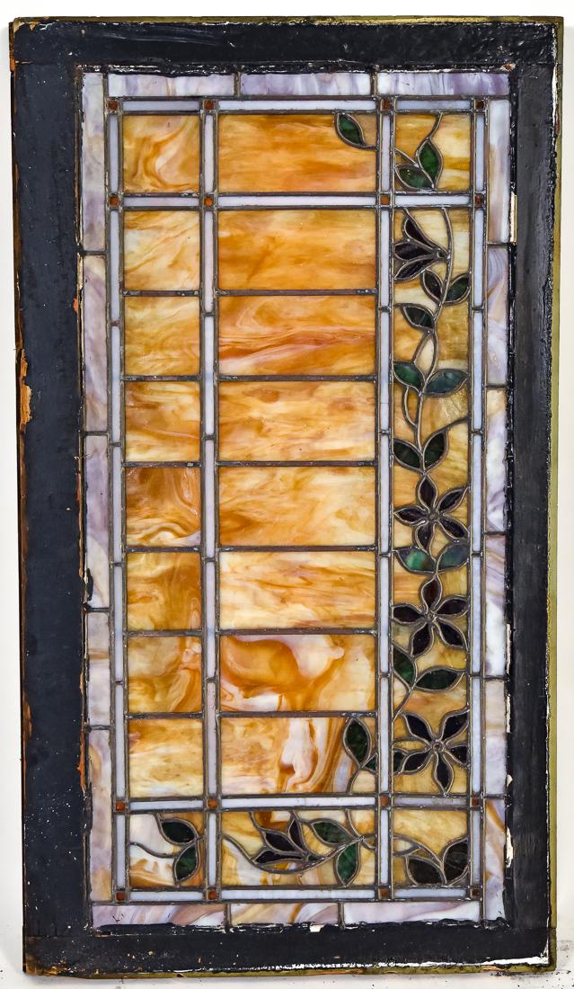 Arts & Crafts Stain Glass Window: Leaded, circa 1900 with vining floral design on geometric ground in various color and slag glass, set in original wooden frames, each 25 1/2 high x 44 1/2" long.