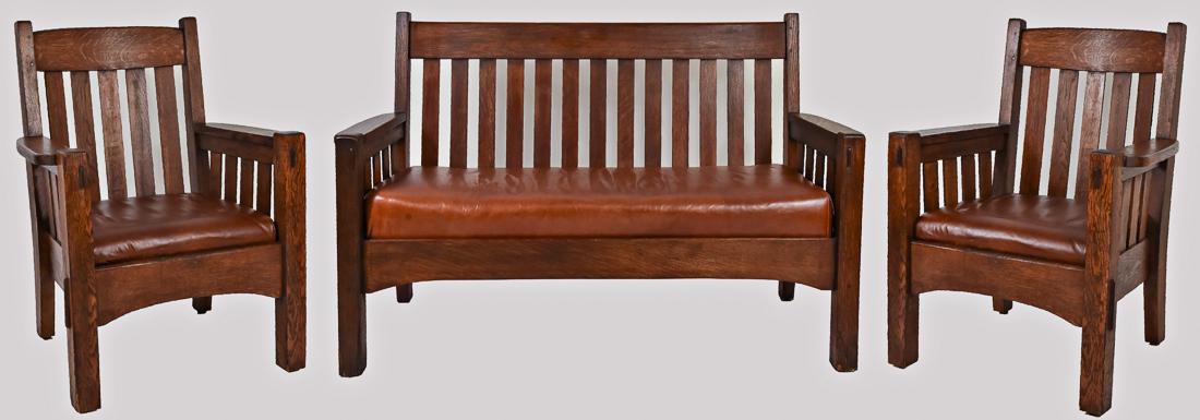 Harden Settee & Chairs: Three pieces in oak, settee with thirteen vertical slat back, four slats under each arm, with mortised through tenon construction and arched front stretcher, fine older finish, good condition, 38 1/2"