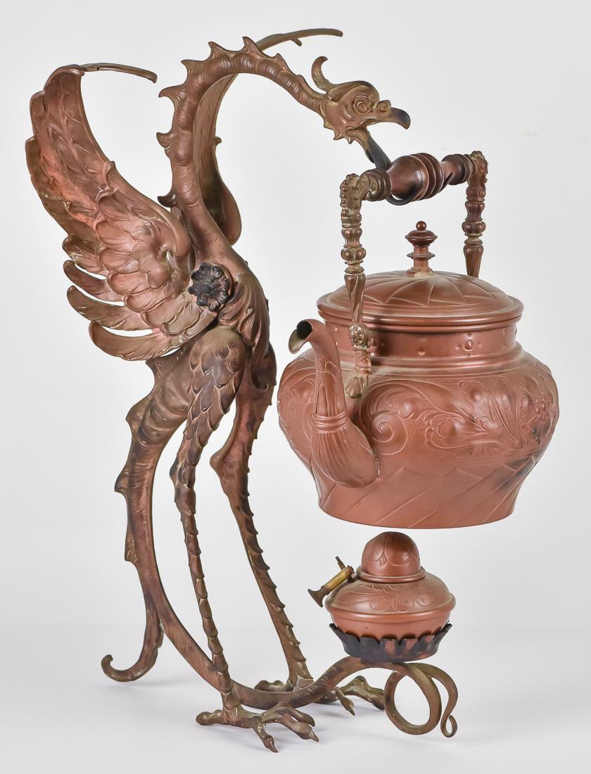 Austrian Bonze & Copper Figural Kettle & Stand: Cast bronze in the form of a dragon with open mouth and forked tongue that forms rest for embossed copper kettle with cast bronze handle and turned wood grip and lid finial. Tail of dragon supports em