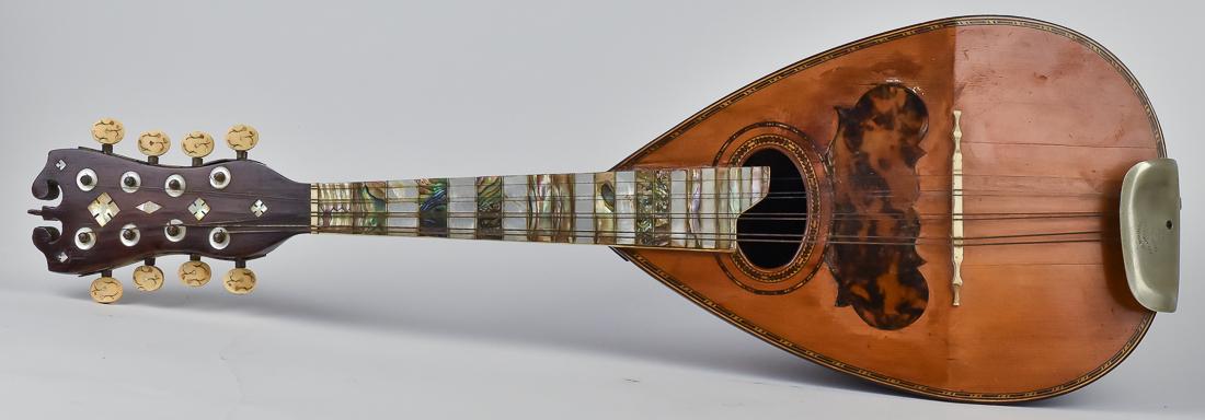 Jos Bohmann Mandolin: Turtle-back type in spruce, rosewood and mahogany with inlaid spruce face, MOP and abalone shell neck, pat. Date April 23, 1885, 24 3/4" long x 8 1/4" wide x 6 1/4" deep.
