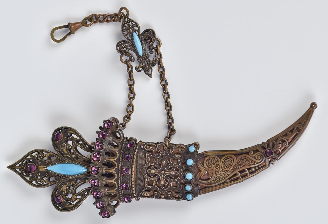 Ornate Brass Dagger: Brass dagger with inset faux gems, Middle Eastern type with scabbard and chain, 6 1/2" long.