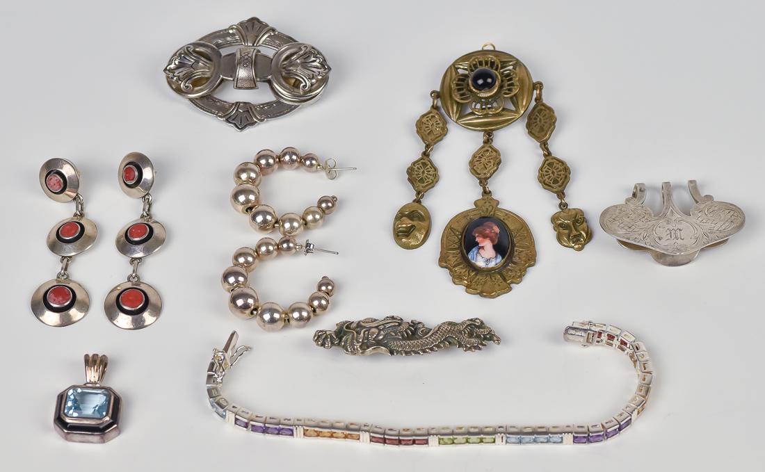 Lot of Sterling Silver Jewelry Plus: Lot of six pieces of sterling silver, and one brass and enameled broach, including engraved money clip, broach with two photo lockets, two pair of earrings, Chinese dragon broach, bracelet with colore
