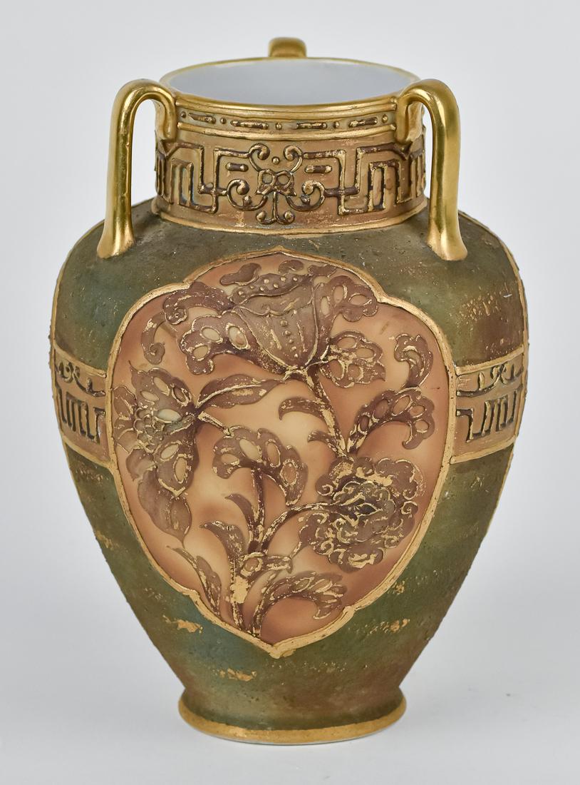 Nippon Vase with Gold Winged Bird: Tri-handled case with unusual textured glaze and three decorated panels. M within wreath backstamp. 7 1/2" high. Good condition.