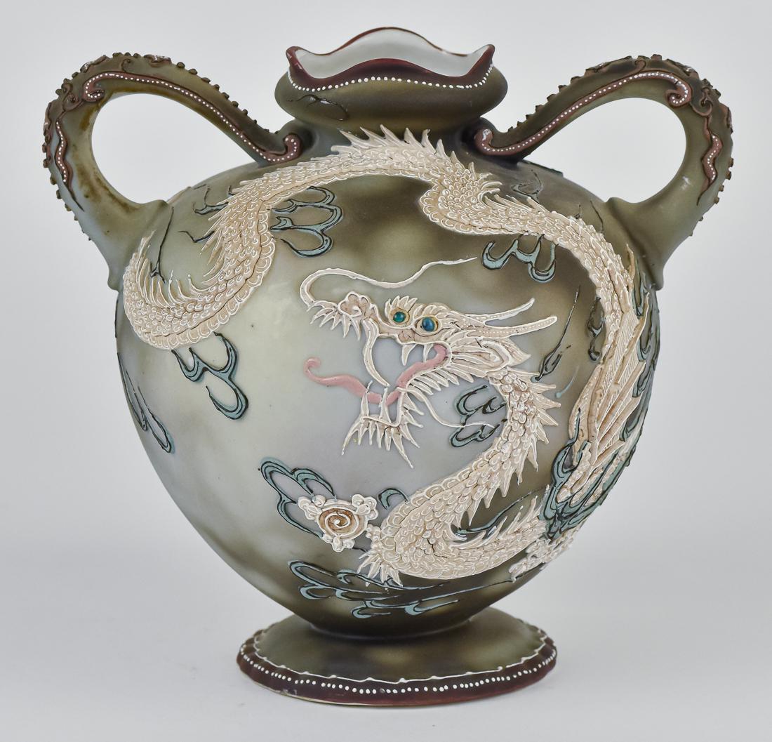 Nippon Moriage Dragon Vase: Double handled. Maple leaf backstamp. 7 1/4" high. A couple of very minor beads missing, otherwise good condition.