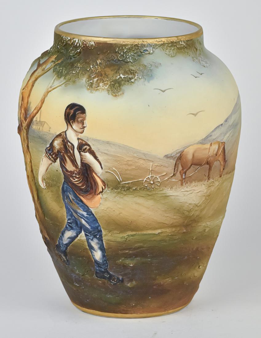 Nippon Johnny Appleseed Molded in Relief Vase: Scarce vase with Johnny in rare blue trousers & horse and plow. M within wreath backstamp. 10 1/2" high. Good condition.