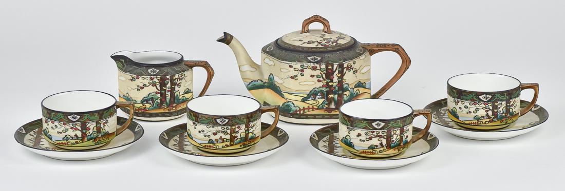 Nippon Woodland Teapot, Creamer & More: Includes teapot, creamer, and four cups & saucers. M within wreath backstamp. 4 3/4" x 9" wide. One cup has line, otherwise good condition.