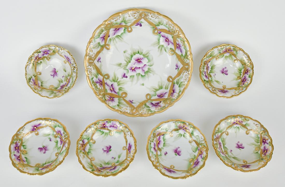 Nippon Berry Bowl Set: Includes 9 3/4" bowl & six 5" berry bowls, all with violet and gold decoration. Maple leaf backstamp. Good condition.