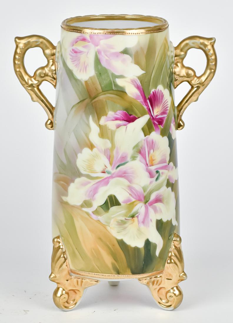 Nippon Tapered Cylinder Form Footed Vase: Double Handled with floral and gold decoration. M within wreath backstamp. 10" High. Good condition.