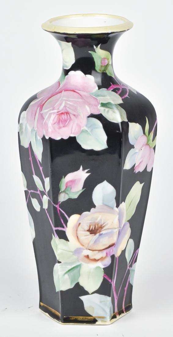 Nippon Six Sided Floral Decorated Vase: On unusual black background. M within wreath backstamp. 9" High. Good Condition.