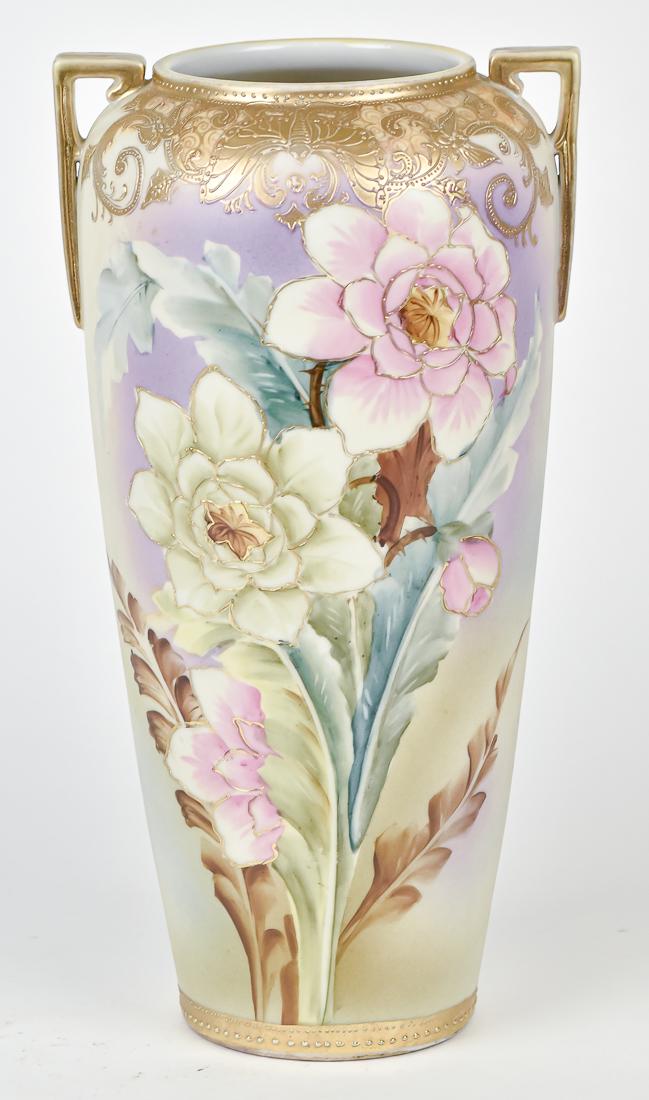 Nippon Floral Decorated Vase: Double handled vase with hand painted florals with gold detailed leaves, and surrounded by gold decoration. With Nippon imperial backstamp. 12" High. Good condition.