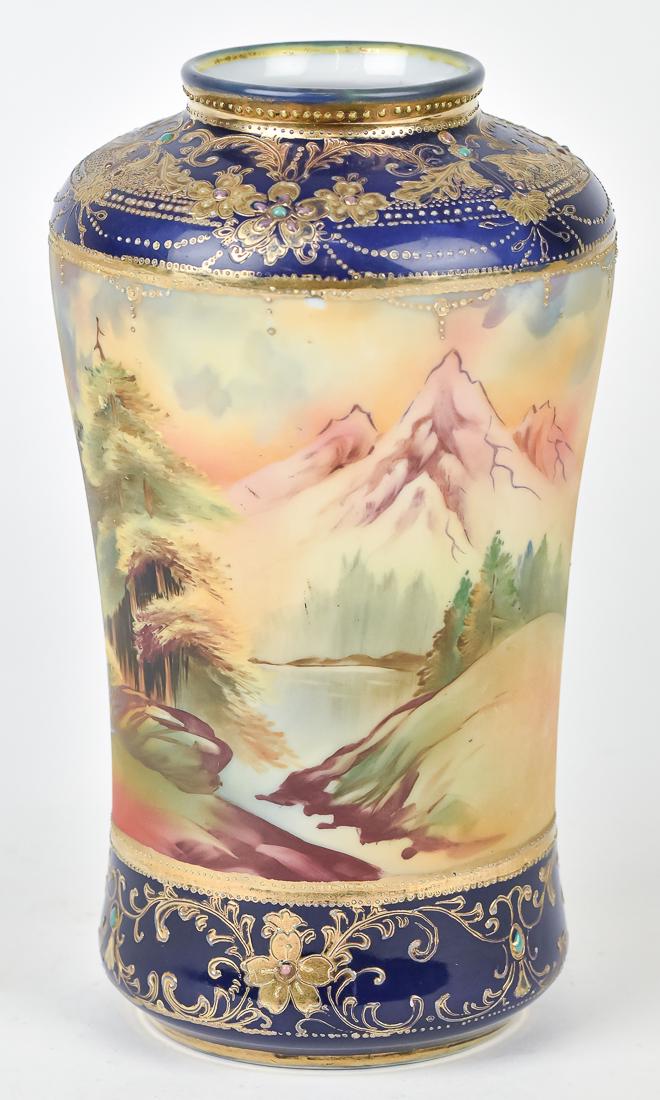 Scarce Nippon Cobalt Blue Red Mountain Scenic Vase: Lovely hand painted mountain scene with trees, surrounded by beaded jewels and gold decoration over cobalt blue. Maple leaf Nippon backstamp. 8 1/2" High. Thin crows foot hairline on bottom, otherwise