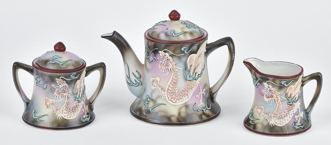 Nippon Moriage Dragon Tea Set: Includes teapot, cream & sugar. Imperial Nippon backstamp. Teapot 6 1/4" high. Good condition.