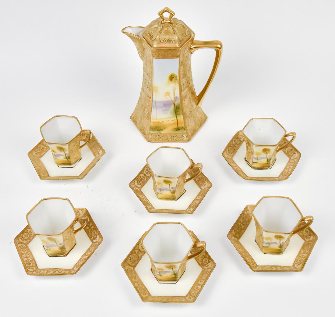 Nippon Chocolate Set with Heavy Gold: Includes Chocolate Pot and six cups & saucers, all with bright fold and two scenic panels. M within wreath backstamp. Good condition.