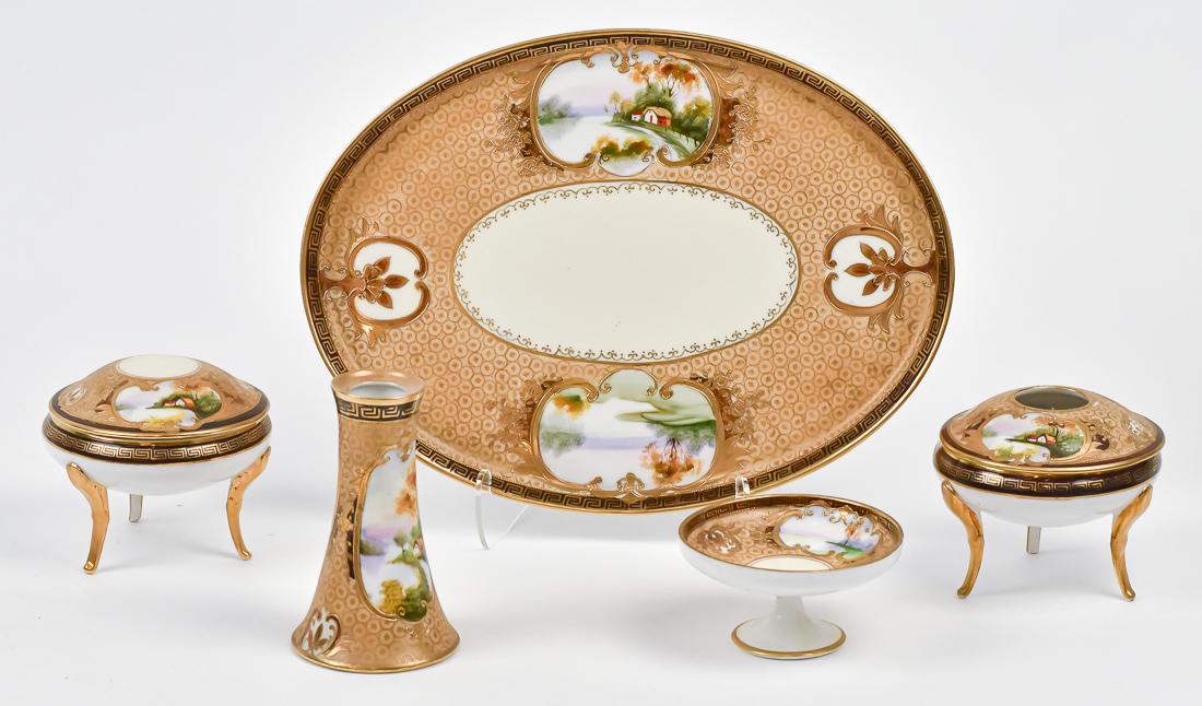 Nippon 5 Piece Dresser Set: Includes hatpin holder, footed hair receiver, footed covered jar, pedestaled tray, and large tray. All with double scenic panels and nice gold work. M within wreath backstamp. Tray, 12" wide. Good con