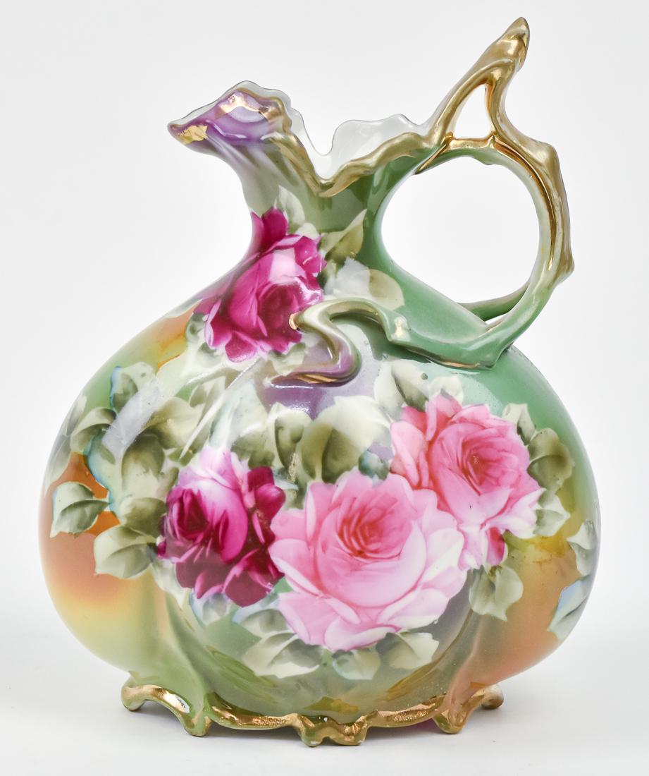 Nippon Ewer with Rose Decoration: Footed ewer with Maple leaf backstamp. 9 1/2" high. Good condition.