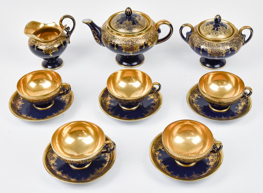 Nippon Cobalt Blue Tea Set: Including lovely pedestal tea pot, creamer, sugar, with five cups & saucers. All with exquisite gold overlapping decoration. Teapot 5 3/4" with Pagoda Nippon backstamp. All in good condition.
