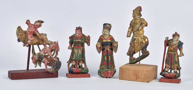 Five Carved Chinese Wood Figures: All early 19th century, with original polychrome and gilt decoration, including three standing warriors/nobles, one priest and one mounted figure battling a figure standing, all on newer hardwood