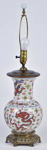 Chinese Vase Converted to Lamp: A fine 19th century porcelain vase with polychrome painted dragons and pheonix with cloud surrounds, 11" high, mounted on a case brass arts & Crafts bronze base with silver finish, total height with