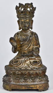 Bronze Seated Buddha: Tibetan or Sino-Tibetan, seated in lotus position and holding cup in left hand and fruit in raised right hand, crowns, on lotus flower base in nice old patina, 2 3/4" x 3 3/4" x 7 1/8" high. Fine