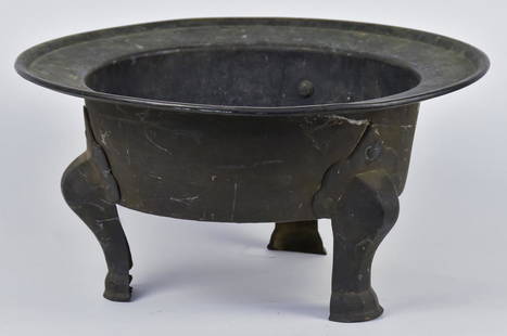 Early Chinese Brazier: 18th or 19th century, made to heat a room with three cabriol legs riveted to body and flaired lip, fine old patina, 15 3/4" diameter x 8" high. Condition, old bronze brazed repair to base, else Fine.