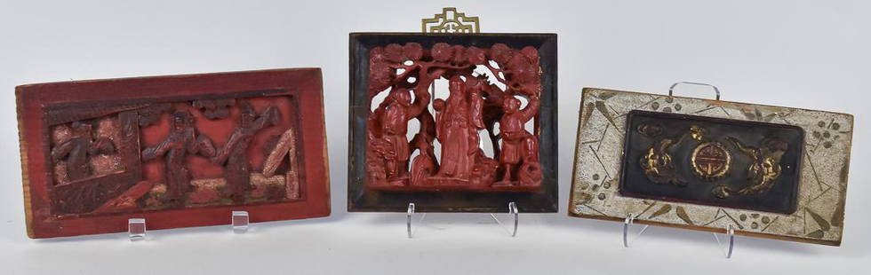 Three Carved Chinese Wood Panels: All 19th century, two painted in imitation of cinnabar, each with three figures in landscape setting, 6" x 7" & 5" x 9 3/4"; and example with two birds in flight surrounding carved circular symbol