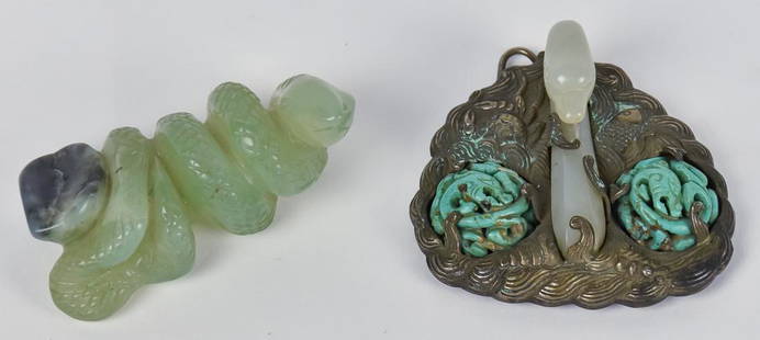 Two Chinese Carved Jade Pieces: Including an early 20th century white jade swans head and neck, mounted in silver pendant with chased waves with leaping fish and sea shells, flanked by pair of carved turquoise half spheres with Chi