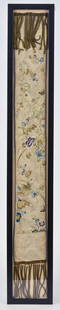 Embroidered Chinese Silk Hanging: Polychrome floral and butterflies on white ground with metalic firing at top and bottom, mounted in black frame, 5" x 31 1/2". Condition, minor fading, else Fine.