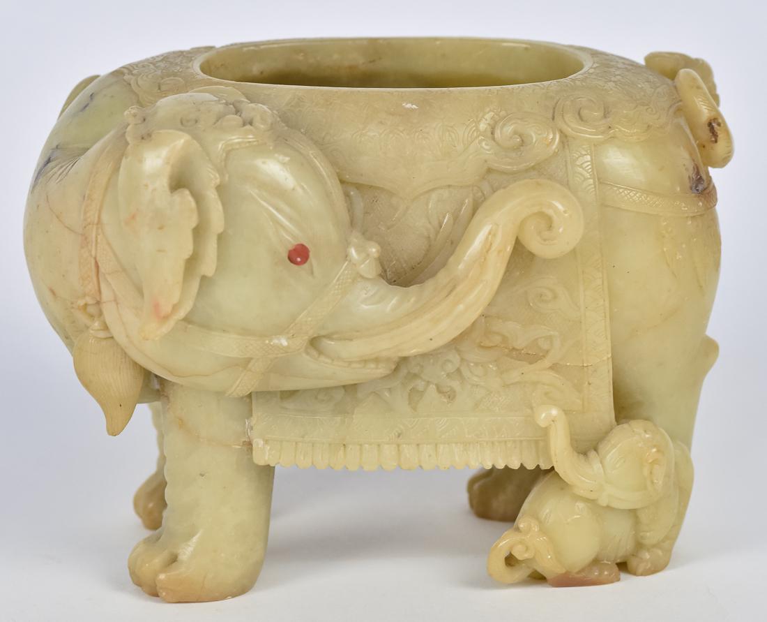 Chinese Carved Soapstone Elephant: with head turned and gem eye, bowl form top, 5 1/2 x 3 1/2 x 4" high. Condition Fine.