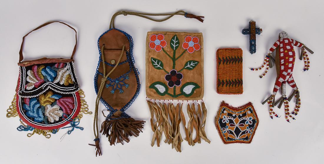 Native American Beadwork: Lot of 7 including a figural fetish with tin tinklers, 8" long; plus early wood cross covered in beadwork, 3 1/8" high x 2" wide; plus Anashnobig beaded pouch with leather & bead fring at bottom, 5 3/