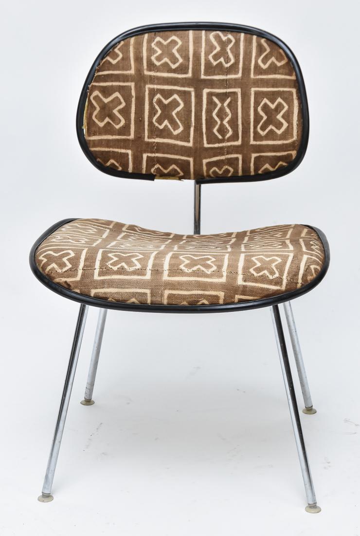 Charles Eames DMC Chair: Upholstered seat and back with X inside square in white on beige, possibly by Girard, mounted on molded plastic frame with stainless legs and back brace, Herman Miller tag on underside, all original a