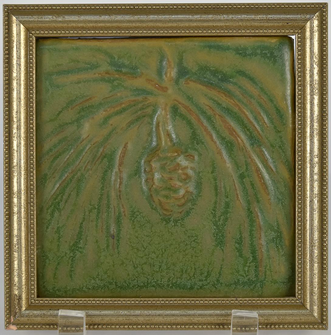Pewabic Art Pottery Tile: Raised pine branch with cone in green mottled matt glaze, marked on back, 5 1/4" square, framed, 6 1/4". Fine condition.