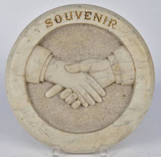 19th Century Claspped Hands Plaque: White polished marble with high relief, male hands on stippled gound with raised and polished surrounding band with "SOUVENIR" carved above, 11 1/4" diameter x 1 3/8" thick. Condition: Fine.