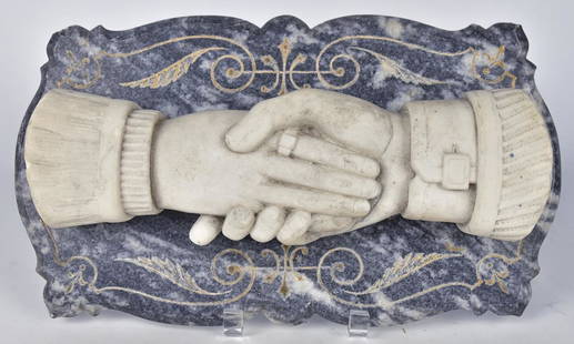 Marble Clasped Hands Plaque: 19th century with full relief, white marble clasped hand, mounted on original veined grey marble plaque with engraved floral scroll work, 15" x 8 1/2" x 3" thick. Condition: minor chip on one finger,