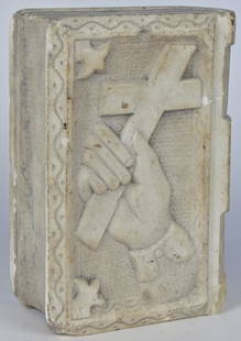 Folk Art Marble Book: 19th century in white marble, with cover having deep relief carving of hand clutching cross on stippled ground with scroll surround, 7" x 10" x 4" thick. Condition: minor edge chips, else fine.