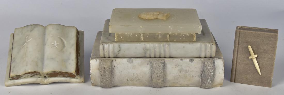 Six Folk Art Carved Stone Books: Three 19th century white marble examples, including Catholic Bible/Prayer Book with deeply engraved chalice with cross on front cover, three high raised bands on spine, rear with stippled cross with c