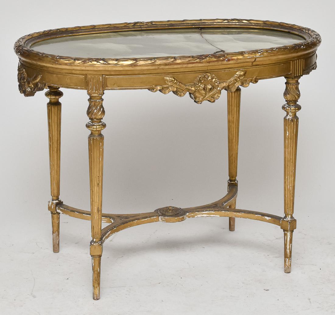Louis XV Gilt Onyx Top Stand: Circa 1870 with green onyx top set in gilt ribbon wrapped laurel wreath surround, sides with crossed Roman staffs with ribbon wraps and laurel wreaths, tapered turned and spiral turned & reeded legs w