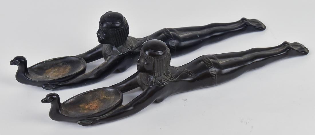 Pair Figural Egyptian Incense Burners: Bronzed white metal of reclining young lady in Egyptian dress with head raised and arms outstretched, holding a goose form bowl, unmarked, circa 1920, 13 1/4 x 2 x 3" high. Condition minor scratches t