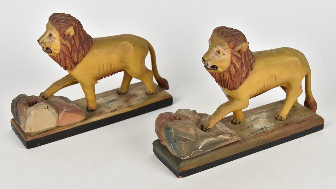 Pair Early Carved & Painted Folk Art Lions: Mounted on rectangular base with front paws resting on carved rock pile, which has hole in top, likely for pen holder, in original polychrome painted finish, faint scratched initials in base of one, D