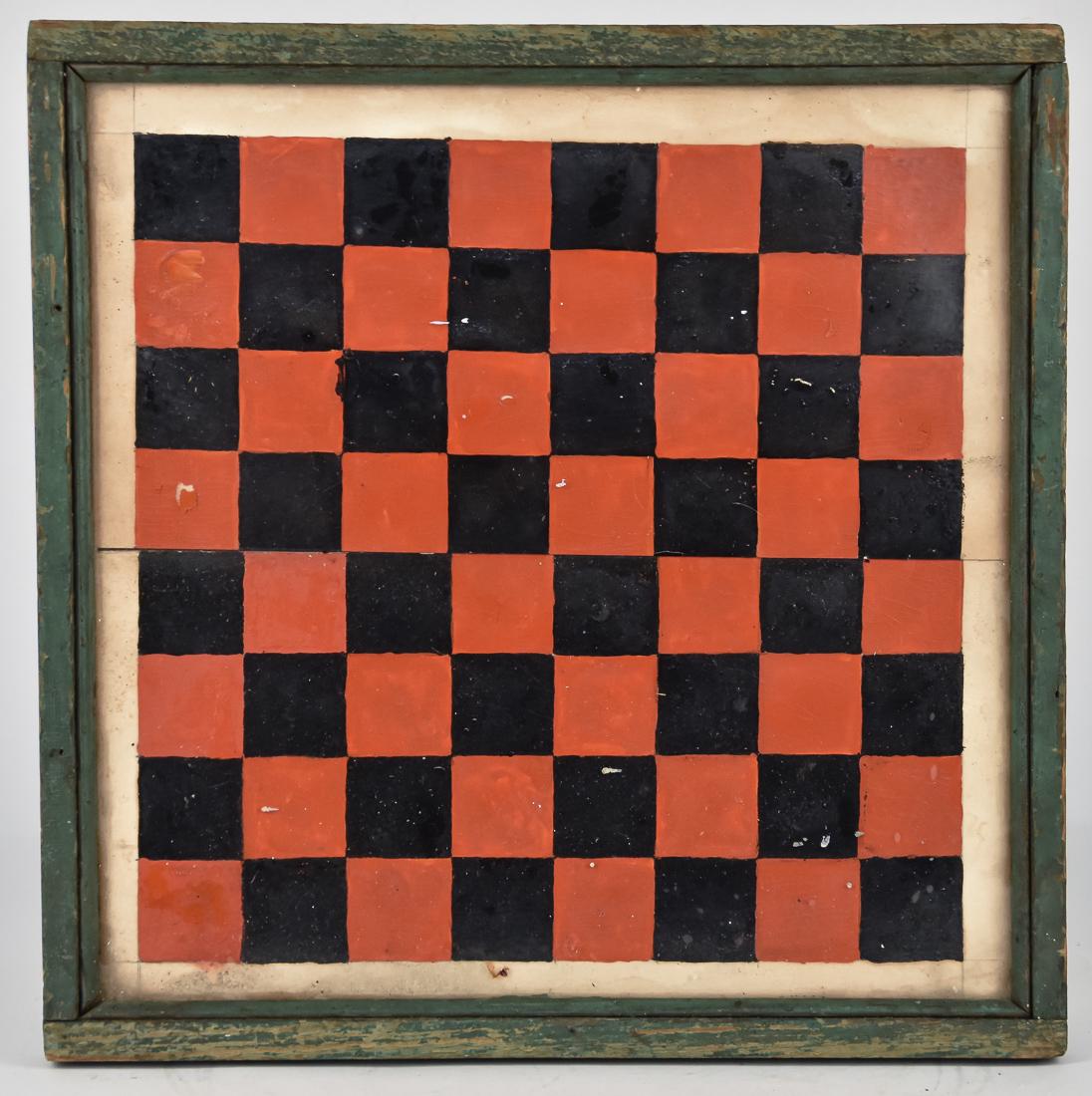 Folk Art Painted Game Board: Checker board pattern in original red, black and white painted wood board, set under original glass with green painted trim. Late 19th century. 15" square. Condition Minor wear to edges, else Fine.