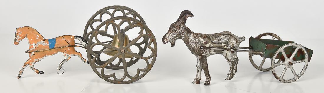 Two Victorian German Pull Toys: Both mid to late 19th century, including a goat cart with silver painted cast iron goat, stamped steel cart in original green paint, two cast iron wheels in silver, 8 x 2 1/2 x 3 3/4" high; and horse