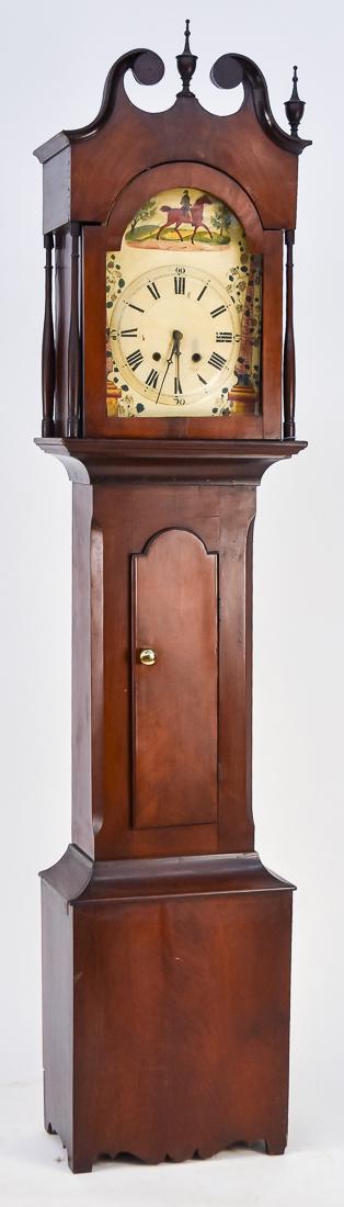 Unusual Small Size American Cherry Tall Case Clock: Circa 1820-30 with dovetailed bonnet with broken arch top with plain rosette terminals and three gracefully turned original finials, over arch top door, flanked by turned & tapered columns, over waist