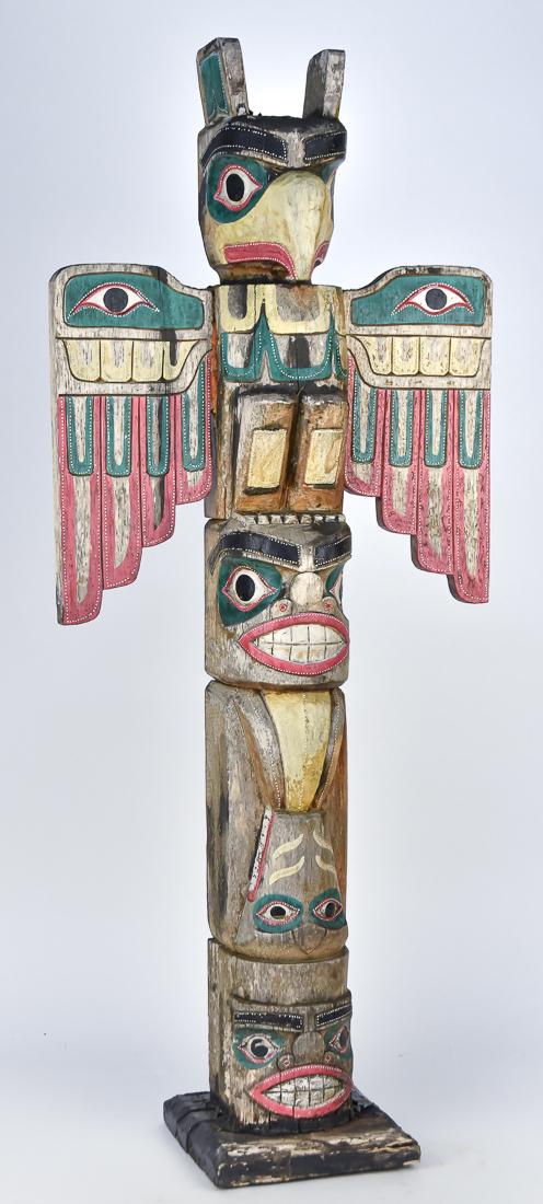 Carved & Painted Totem Pole: Late 20th century with four stacked figures including spread winged eagle at top, in original weathered polychrome painted and varnished finish (some parts only varnished), 17 x 7 x 39 1/2" high. Cond
